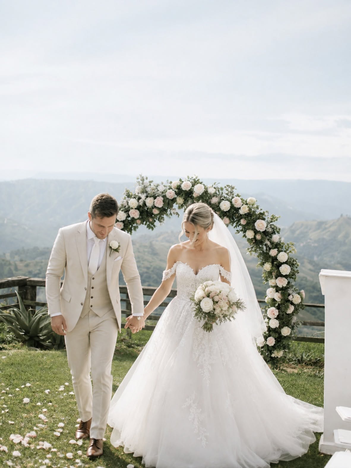 A couple walking on the lawn at Aurum Sky with the KwaZulu-Natal hills behind them
