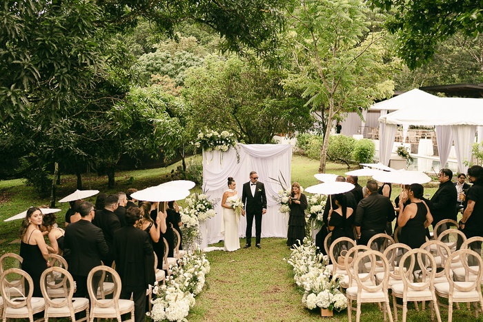 A garden ceremony at the estate beneath the trees